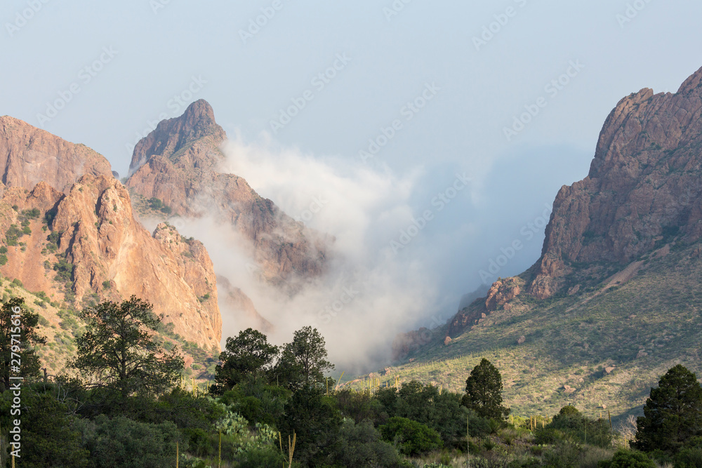 Clouds passing over 'The Window' in the Chisos Basin during the day in Big Bend National Park (Texas).