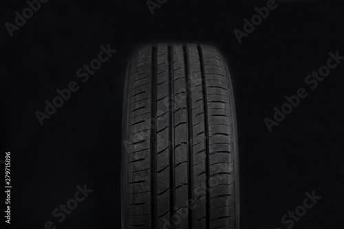 Car tires on black background. Shop Tires and wheels.