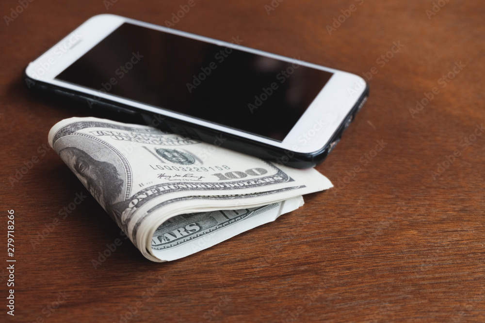 Money and smartphone blank space for text or advertising media Money and smartphone blank space for text or advertising media