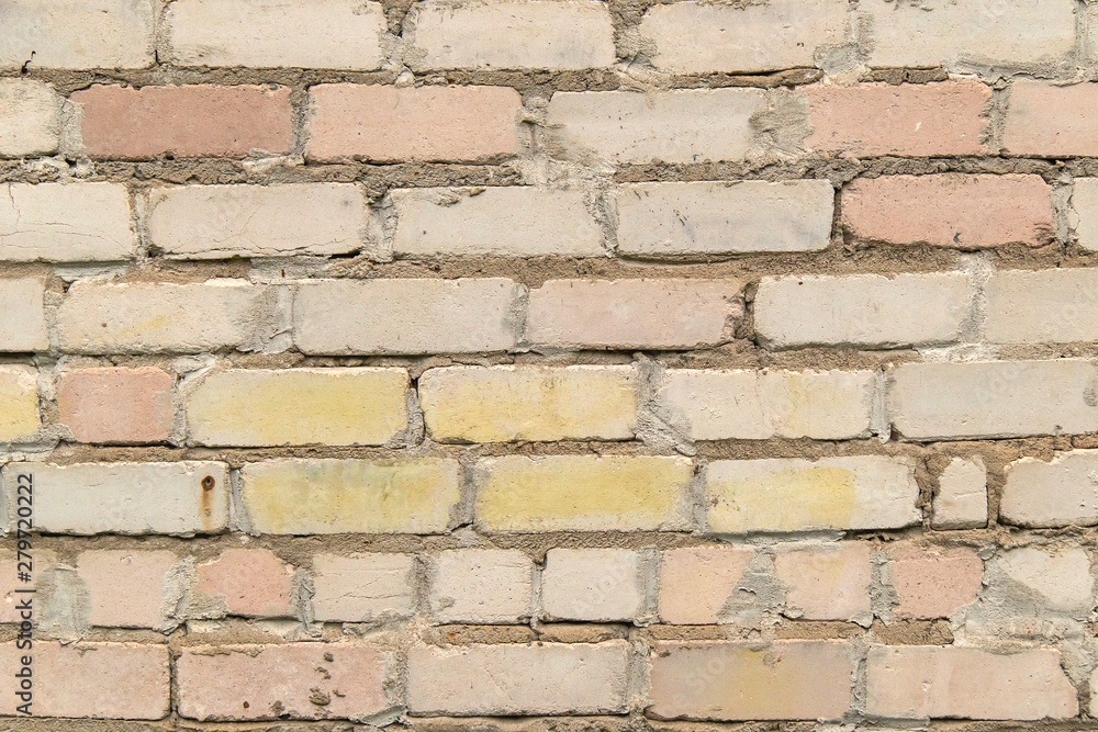 textured, expressive wall of light-colored bricks textured, expressive wall of light-colored bricks