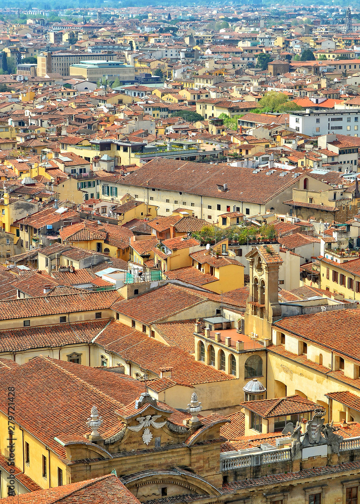 Aerial view. Red tile roofs of Italian buildings in the old city. Urban landscape. Italy, Tuscany, Florence