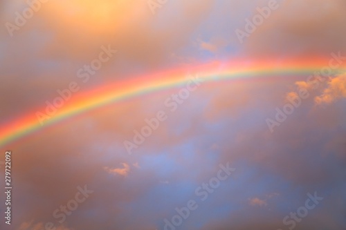 Rainbow agains cloudy sky © Gudellaphoto