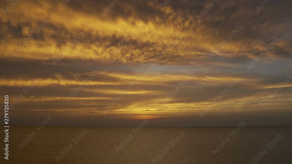 Evening clouds dramatic sky over sea horizon at sunset Evening clouds dramatic sky over sea horizon at sunset