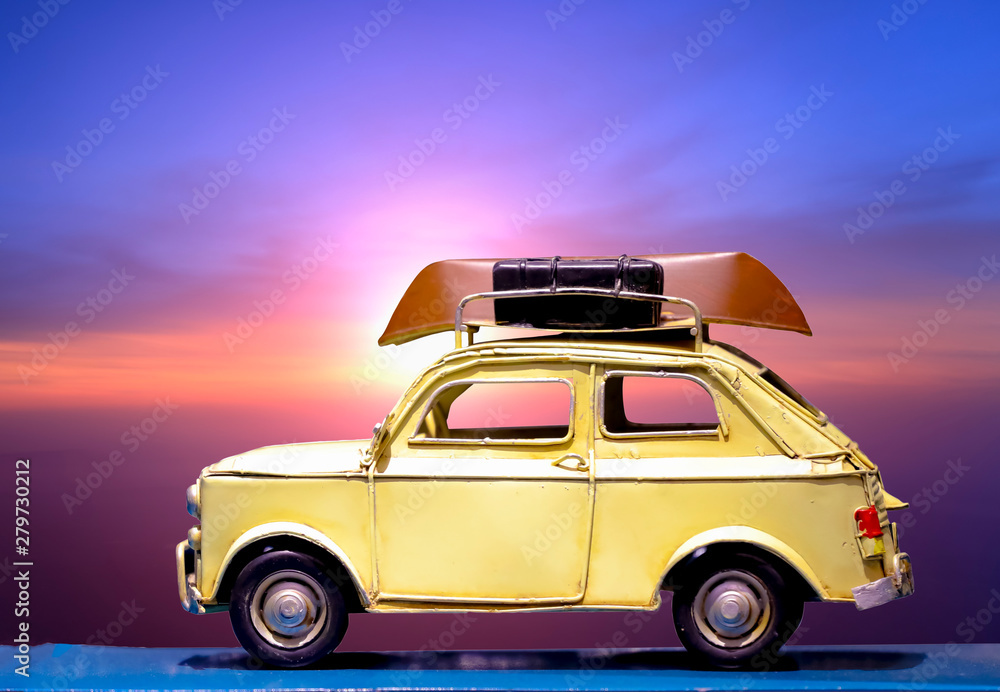 Traveling concept : vintage car with twilight sky on background
