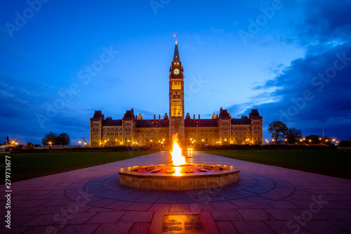 Принти на полотні Canada parliament building and centennial flame fountain in Ottawa during blue h