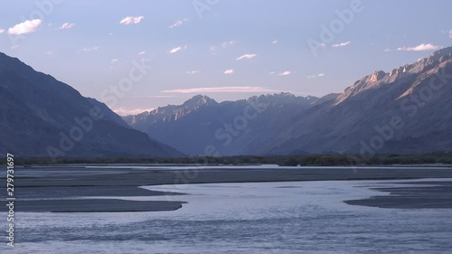 Wonderful strong mountain ranges in Nubra Valley near Sumur village, Ladakh, India. Beautiful riverside of Shyok River. The Himalaya mountains in the evening. Peaceful sunset. Tranquil highland photo