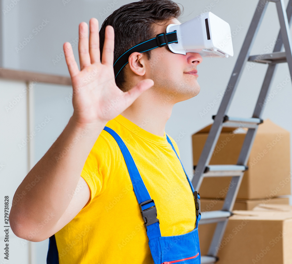 Painter contractor working with virtual reality goggles Painter contractor working with virtual reality goggles