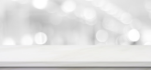 Empty white table top, counter, desk background over blur perspective bokeh light background, White marble stone table, shelf and blurred kitchen restaurant for food, product display mockup, template