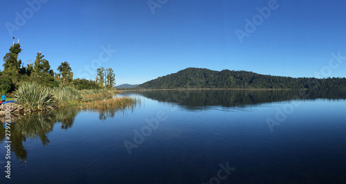 Mirror image reflections on a serene calm South Island Lake