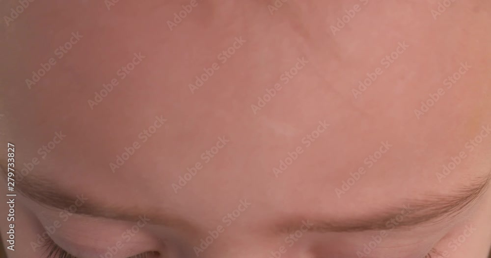 Slow motion close up on the beautiful blue eyes of a little girl Slow motion close up on the beautiful blue eyes of a little girl
