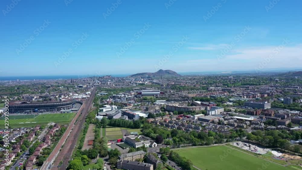 A wide shot of Edinburgh, flying towards Arthur's Seat in the distance on a sunny Summer's day| Edinburgh, Scotland | Shot in 4k at 30 fps A wide shot of Edinburgh, flying towards Arthur's Seat in the distance on a sunny Summer's day| Edinburgh, Scotland | Shot in 4k at 30 fps