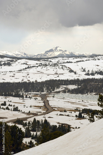 Cars driving on the snowy Beartooth highway in early summer