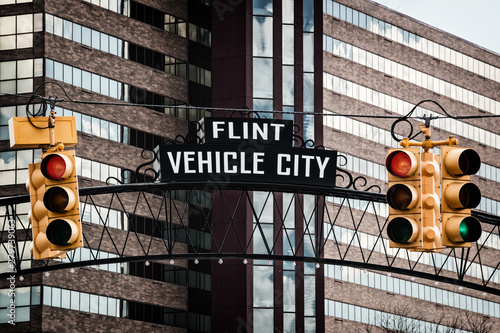 Flint, Michigan downtown gateway sign showing Vehicle City. Known widely for their water quality and safety issues.