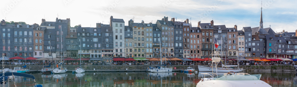 Honfleur, France - 06 01 2019: Panoramic view of the harbor at sunset