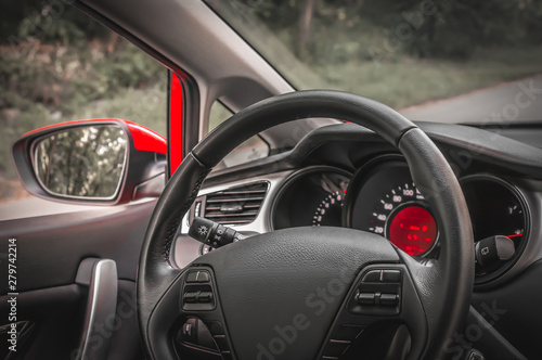 Car interior with steering wheel and dashboard