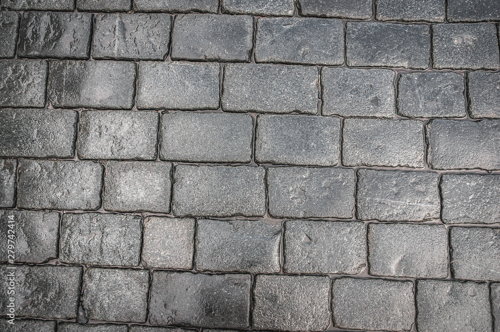 Grey cobblestone pavement after the rain in the Czech Republic Grey cobblestone pavement after the rain in the Czech Republic