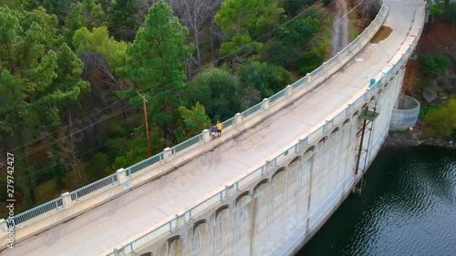 drone shot in Hollywood reservoir bridge dividing water and land.