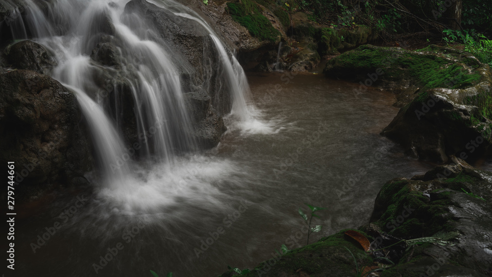 Beautiful waterfall with soft water in the forest Beautiful waterfall with soft water in the forest