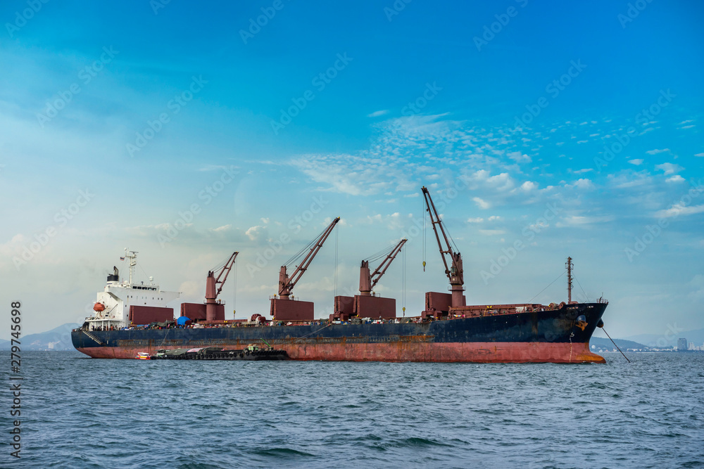 A cargo ship or freighter ship on sea in Thailand. International trade.