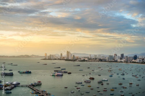 Landscape view of Pattaya beach, Thailand. Many floating ships and pleasure boats in the sea. Top view of the moving water transport, coastline.