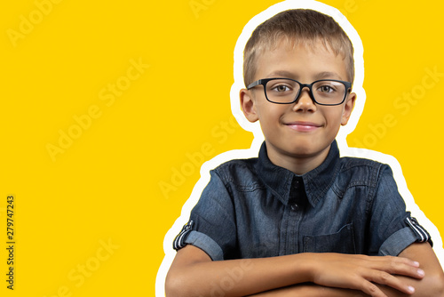 Banner happy smiling boy with glasses black shirt on yellow background Portrait of a 7 year old boy collage photo