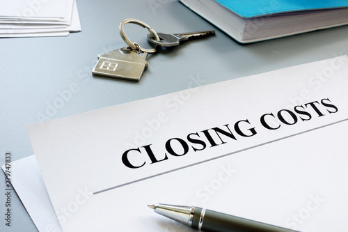 Documents for closing costs and keys.