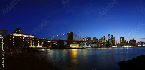 New York City downtown skyline and Brooklyn bridge at sunset © leochen66