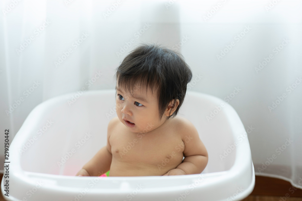 Cute Sweet Adorable Asian Baby Sitting on bathtub with plastic balls smiling and playing with happiness emotional in cozy bedroom,Healthy Baby Concept Cute Sweet Adorable Asian Baby Sitting on bathtub with plastic balls smiling and playing with happiness emotional in cozy bedroom,Healthy Baby Concept