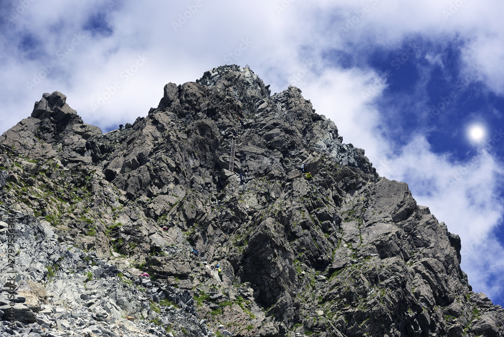 Mountain climber climbing Mt. Yarigatake, Japan Alps