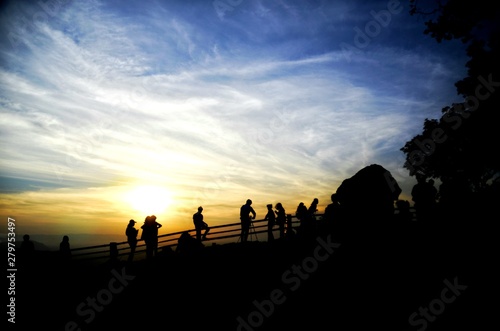 silhouette of people at sunset