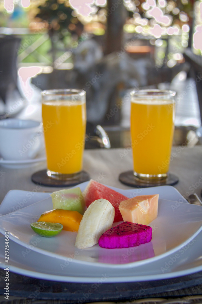 tropical fuits salad and orange juice as breakfast tropical fuits salad and orange juice as breakfast