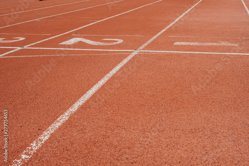 Sport. A red treadmill or athletics track at the stadium. Copy space