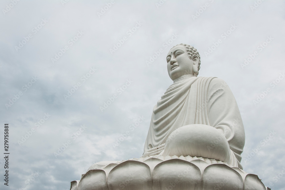 White buddha statue in the cloudy sky White buddha statue in the cloudy sky