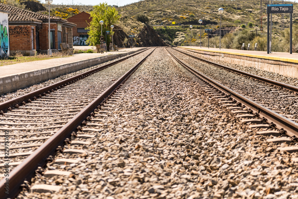 Oxidized railway tracks next to the abandoned Rio Tajo train station, near Garrovillas de Alconetar