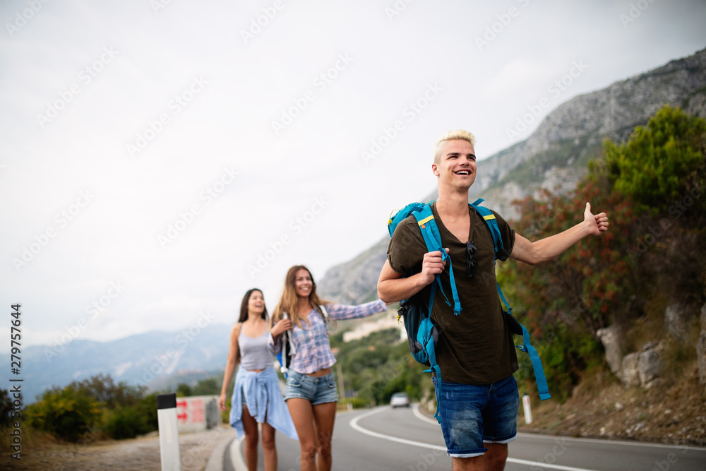 Group of happy friend traveler walking and having fun. Travel lifestyle and seasonal vacation concept