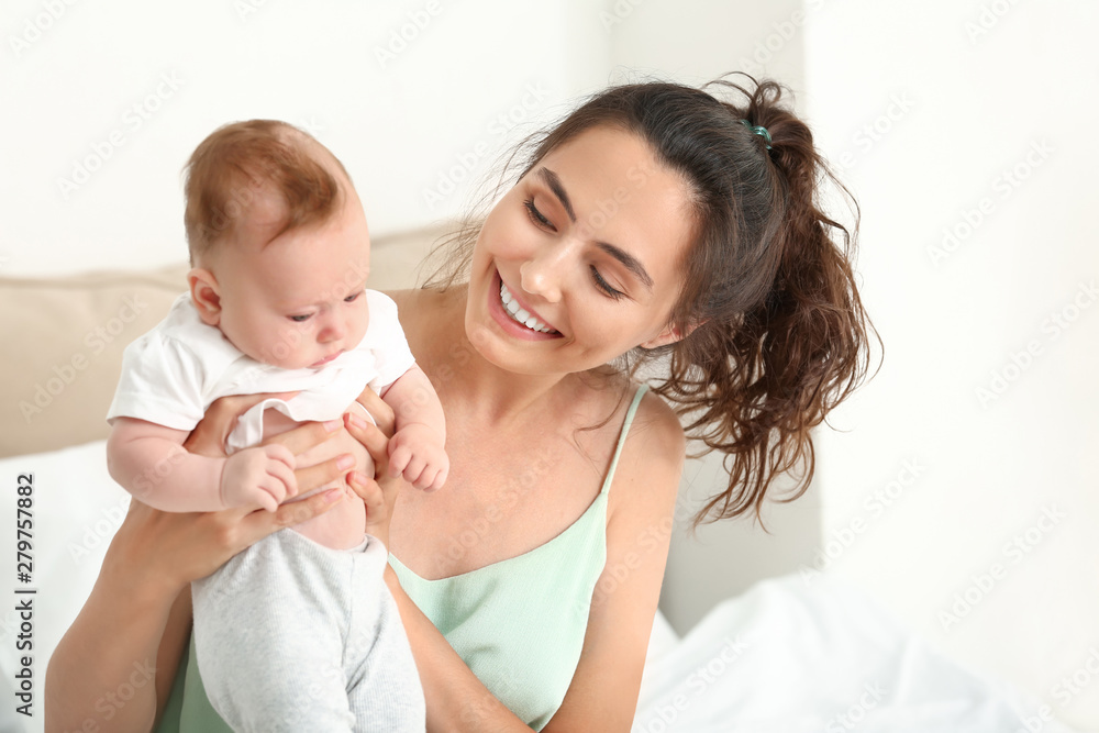 Happy mother with cute little baby at home Happy mother with cute little baby at home