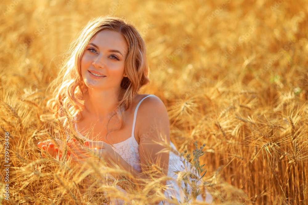 Beautiful young woman in wheat field at sunset outdoor . Beautiful young woman in wheat field at sunset outdoor .