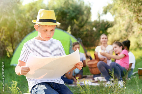 Little boy studying map at ...