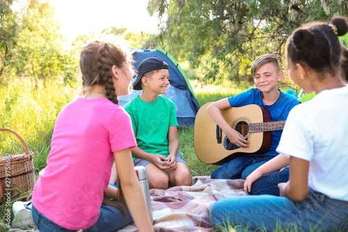 Group of children resting a...