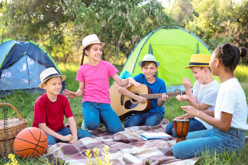 Group of children resting a...