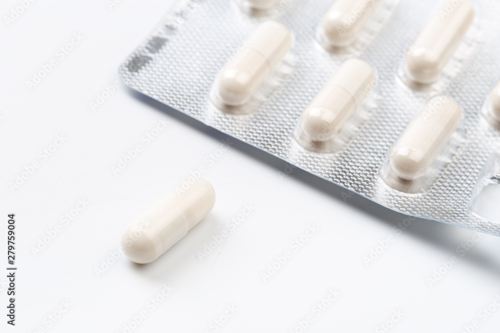 Pile of white capsules probiotic powder inside. Copy space. High resolution product. Health care concept - Image Pile of white capsules probiotic powder inside. Copy space. High resolution product. Health care concept - Image