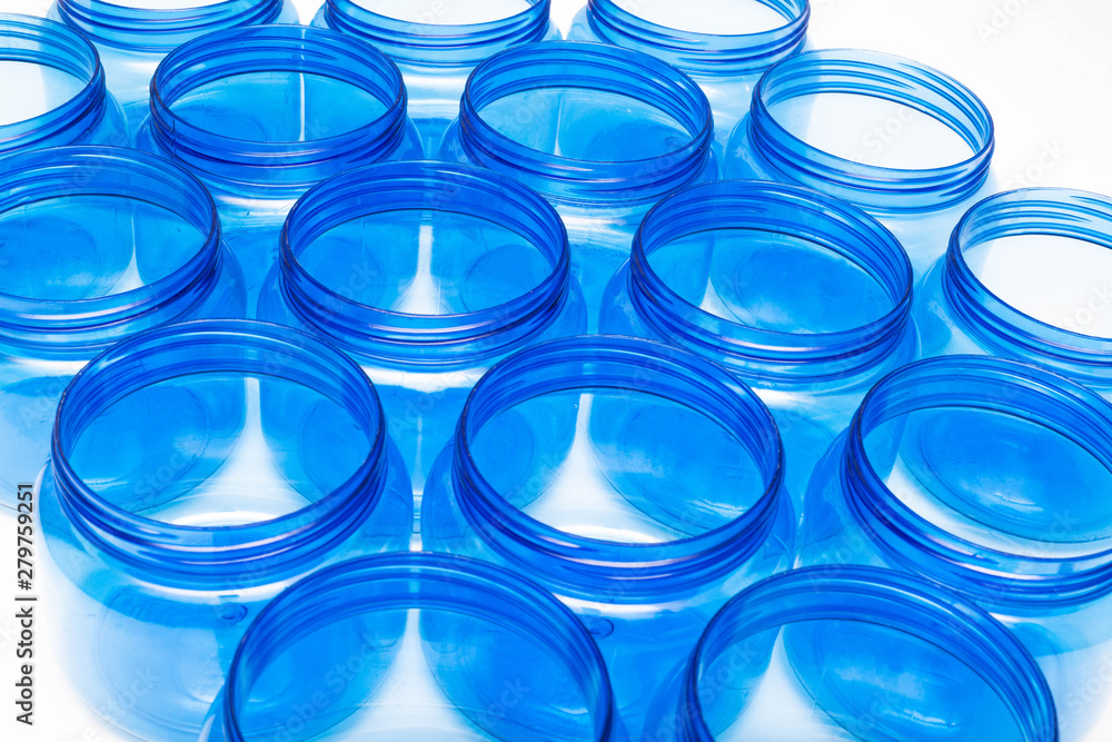 Blue plastic jars on a white background isolate, polyethylene terephthalate, tara Blue plastic jars on a white background isolate, polyethylene terephthalate, tara