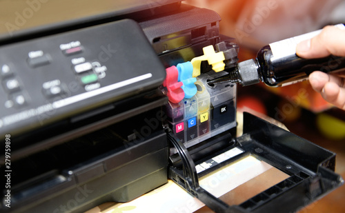 Картината върху платно refill ink tank printer at office - Close up printer cartridge inkjet of color b