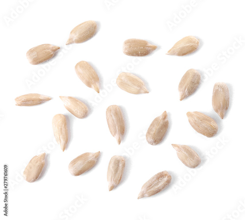 Peeled sunflower seeds on white background