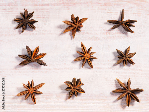 Anise (Anisum vulgare) on a wooden background