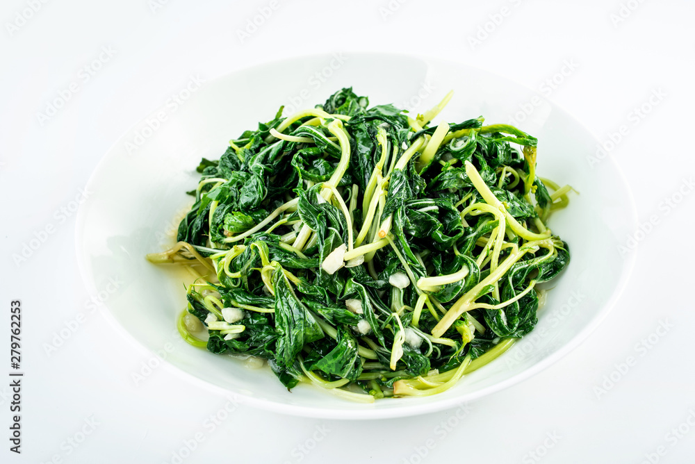 Chinese Chaoshan Vegetable Garlic Fried Hemp Leaf on White Background Chinese Chaoshan Vegetable Garlic Fried Hemp Leaf on White Background
