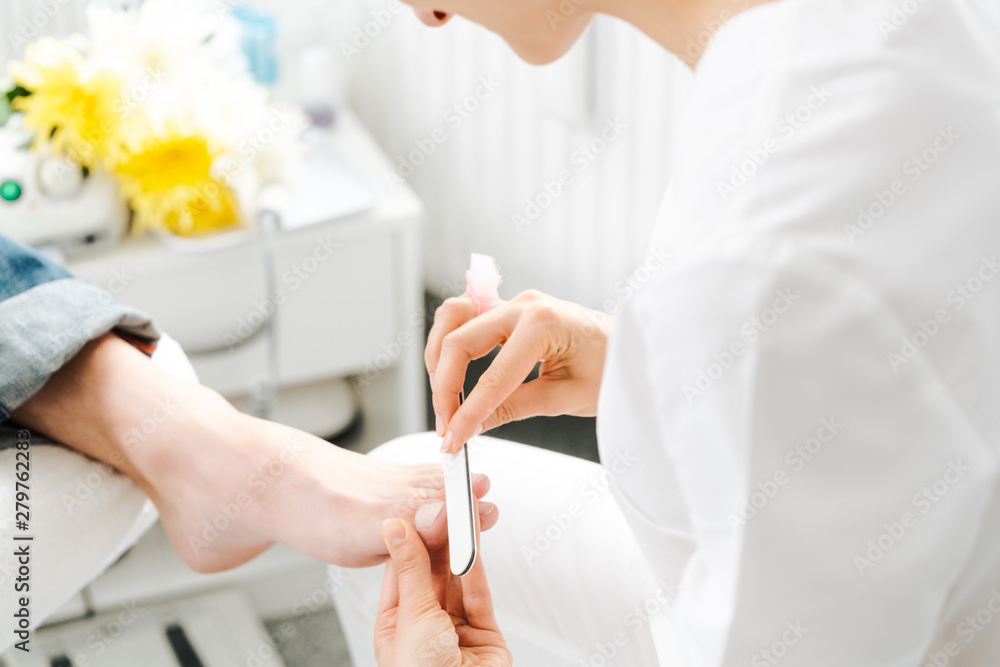 Podiatrist working on men's feet Podiatrist working on men's feet