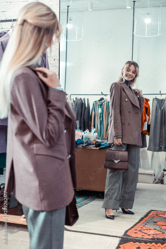 Businesswoman smiling while shopping at the weekend Businesswoman smiling while shopping at the weekend