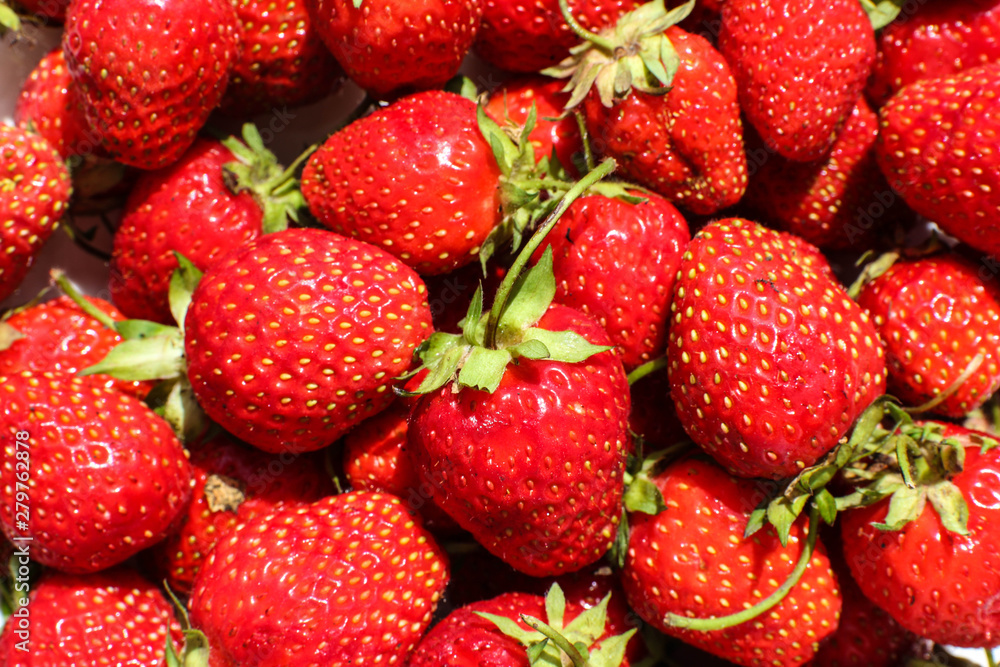 Bunch of ripe red strawberries close up. Healthy eating background. Bunch of ripe red strawberries close up. Healthy eating background.