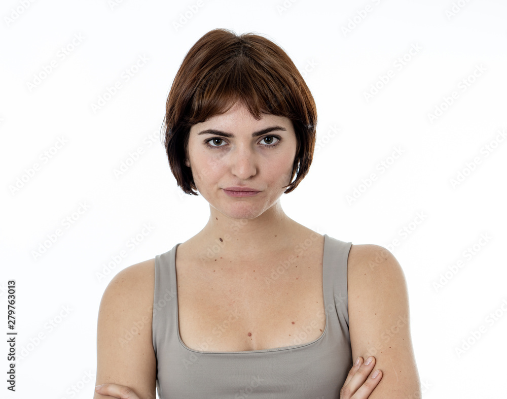 Portrait of a beautiful young woman with angry and harsh face. Human expressions and emotions Portrait of a beautiful young woman with angry and harsh face. Human expressions and emotions